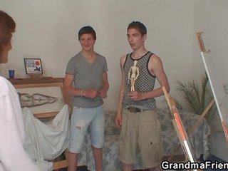 Naughty granny takes two young dicks